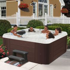 children playing in an outdoor hot tub with the words evolution spas written on it