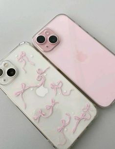 two iphone cases with pink bows on them, one has an apple camera and the other is