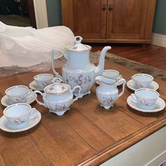 the tea set is sitting on the table