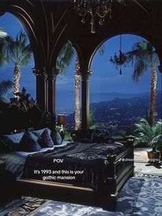 the bedroom is decorated in black and white with chandelier hanging from the ceiling