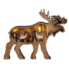 a wooden moose ornament with lights on it