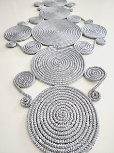 several circles are arranged on the floor in an intricate pattern, and one circle has been made out of rope