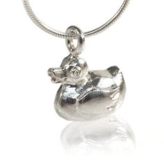 Bath Duck PendantThis unique Bath Duck pendant is a part of my Childhood Memories collection. An iconic toy earrings for a fun and playful dayThis exciting collection was created as a tribute to kids and children at heart.Designed to match the shape of toys we all remember from our childhood and recreate happy memories of games shaping our world. The pendant is especially ergonomic and perfectly adapts to the shape of the chest.Height: 0.6 cmWidth: 1 cmMaterial: Silver 925 Chain: standard length Duck Necklace, Bath Duck, Duck Yellow, Yellow Rubber Duck, Traditional Rings, Geek Jewelry, Hand Sculpture, Sterling Pendant, Rubber Ducky