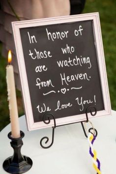 a chalkboard sign that says in honor of those who are watching from heaven we love you