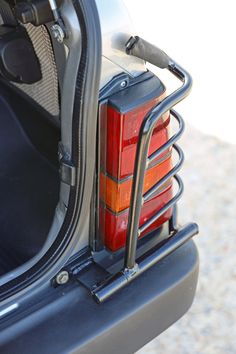 the rear end of a car with luggage in it