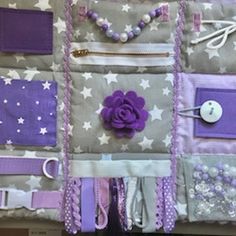 a purple and white purse with many different items on it