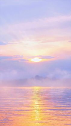 the sun is setting over the water and clouds are in the sky, with one boat floating on the water