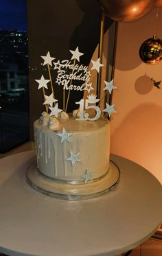 a birthday cake with white stars on it