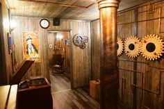 a room with wood paneling and clocks on the wall, along with other items