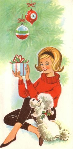 a woman sitting on the ground holding a gift box next to a dog and christmas tree