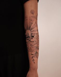 a person with a flower tattoo on their arm