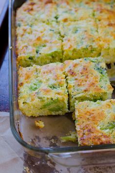 broccoli and cheese casserole in a glass baking dish on a table