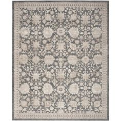 a gray and white rug with an intricate design