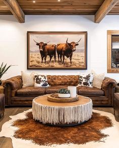 a living room with two cows on the wall