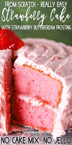 a close up of a slice of cake on a plate with strawberries in the background