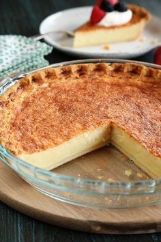 a pie sitting on top of a wooden cutting board