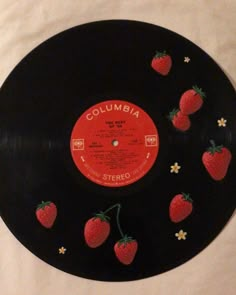 an old record with strawberries on it