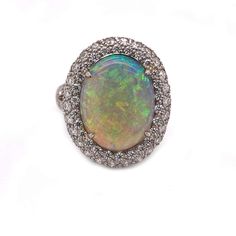 For Sale on 1stDibs - A beautiful platinum Opal & Diamond ring. This, lovely 4.50cts Opal ring is surround with 2cts of diamonds in a Platinum mounting. This beautiful ring Luxury Women's Opal Ring With Polished Finish, Elegant Luxury Hallmarked Opal Ring, Luxury Unique Polished Opal Ring, Luxury Silver Hallmarked Opal Ring, Luxury Silver Opal Ring, Hallmarked, Opal And Diamond Ring, Opal Diamond Ring, Fancy Jewellery