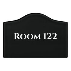 a black sign that says room 122