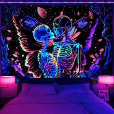 a bed in a room with a neon colored wallpaper and a lit up skeleton on the headboard