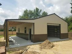 a two car garage with an attached carport