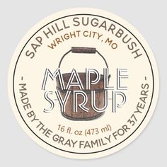 maple syrup sticker with the words maple syrup written in white and brown on it