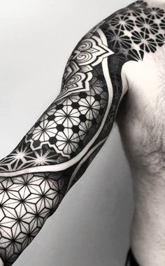 a man's arm with an intricate design on it