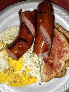 breakfast plate with sausage, eggs and toast