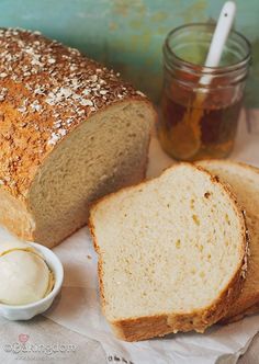 a loaf of bread and some butter on a table