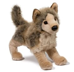 a stuffed animal that looks like a wolf is standing on its hind legs and looking at the camera