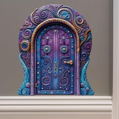 a purple and blue door sitting on top of a white shelf