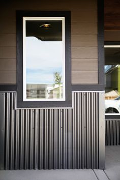 an open window on the side of a house