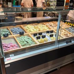 a display case filled with lots of different types of food