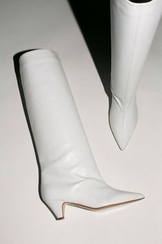 A knee high boot for everyday with an easy 2.5", cone shaped heel. 100% leather upper, made in Italy. Available in mango suede, white leather, and rosa suede. 60s White Boots, White Boots, White Flats, Custom Items, Knee High Boots, White Leather, Knee High, Leather Upper, Mango