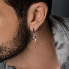 "✈️ Free DHL Express shipping to USA, EU countries & Canada - delivery in just 2 days! Totally handmade 925 solid sterling silver hoop earring for pierced ears with a unique ✝cross charm, with a wire wrapped center and hammered shiny finish! 🛒Price is for a single earring. ✔Requires one standard ear piercing. Their base metal is 925 solid sterling silver which is plated so it doesn't tarnish and can be more resistant to shocks and distortions. This way the need for constant maintenance and poli Cross Ear Piercings Men, Dangle Cross Earrings, Earring For Men, Cross Earring, Mens Designer Jewelry, Gothic Men, Edgy Elegance, Black Hoops Earrings, Mens Valentines Gifts