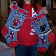 a woman is holding up two pairs of jean pants with bows on them and sequins