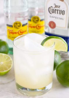 an alcoholic cocktail with limes and vodka