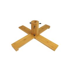 four pieces of wood sitting on top of each other in the shape of three crosses