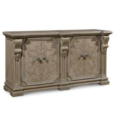 an antique style sideboard with ornate carvings on the front and sides, painted beige