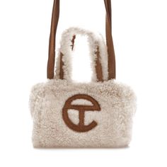 Telfar x UGG Reverse Shopping Bag Small Natural in Sheepskin/Suede Telfar Cream, Ugg Telfar, Telfar X Ugg, 30’s Fashion, Telfar Bags, Western Outfits Men, All Nike Shoes, Jelly Bag, Bag Outfit