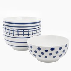 two bowls with blue and white designs sit side by side in front of each other