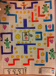 a child's drawing of a maze with frogs and hearts on it, in the middle of a notebook