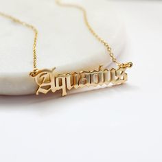 Beautiful and lovely Zodiac sign necklace made of gold plated  Aquarius script pendant with skinny gold chain. Soft and warm and great for a gift item.  Your necklace will ship in a gift box. If you have any questions, please feel free to contact me. Thanks :)    * Chain length 14"- 20" * Pendant 3/8" x 1.5"  * Gold plated brass * Zodiac Jewelry Birthday Jewelry Astrology Zodiac necklace * Aquarius / the Water Bearer (Jan 20 - Feb 18)  * Delivery Time Fast shipping within 1 - 3 days  *See more Rudiana Accessories +  www.Rudiana.etsy.com Aquarius Necklace, Script Necklace, Zodiac Sign Necklace, Zodiac Necklaces, Zodiac Jewelry, Astrology Zodiac, Chain Lengths, Gift Item, Gold Chains