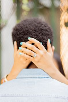 a woman covering her face with her hands