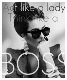 a woman wearing sunglasses and holding her hand to her face with the words boss on it