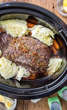 a pot roast with carrots and cabbage in it