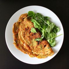 some food is on a white plate and ready to be eaten