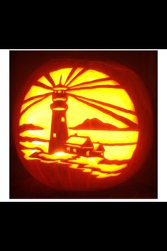 a pumpkin carved to look like a lighthouse