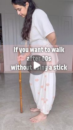 a woman in white dress holding a wooden stick with text overlay that reads, if you want to walk after 30's without being stuck