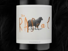 a bottle of wine with an animal on the label and some black fur around it